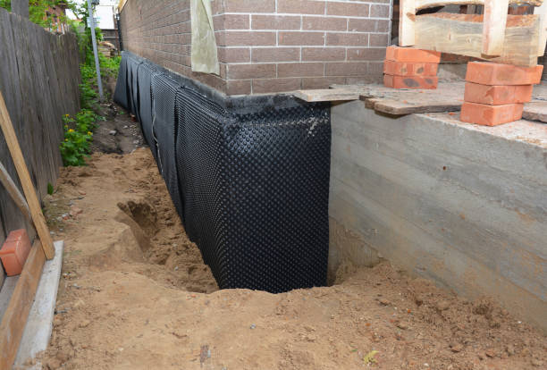 SJ Waterproofing Pros technician performing targeted Wet Basement Repair assessment in Whites Creek, TN